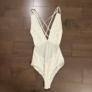 Low cut, open back bodysuit